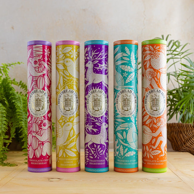 A product image of five colourful tins with animal designs.