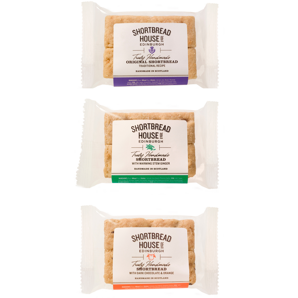 Three packages of Shortbread House of Edinburgh shortbread biscuits in 2-finger packets on a white background