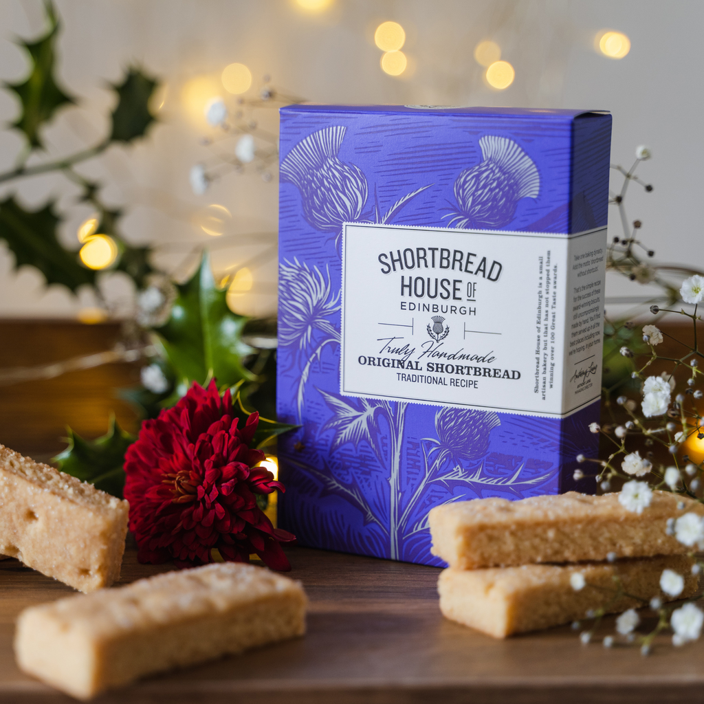 Shortbread packaging with biscuits on a decorative background