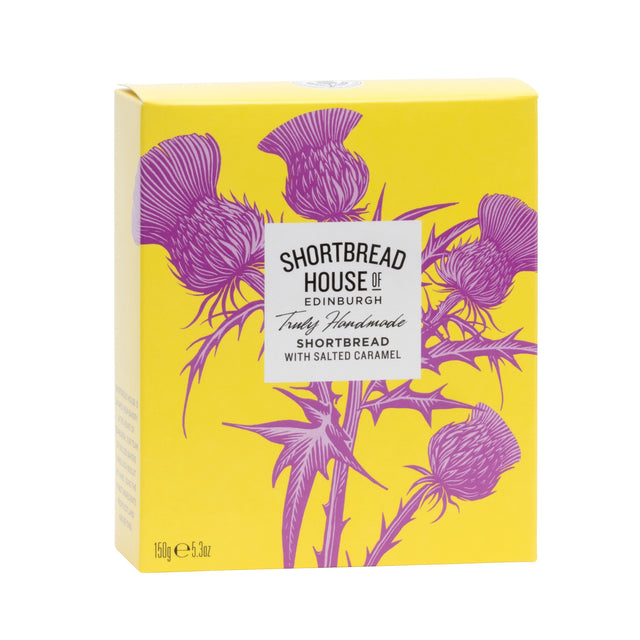 A yellow rectangular box of Shortbread House of Edinburgh Truly Homemade Shortbread with Salted Caramel, decorated with pink thistle illustrations and a white label in the center.