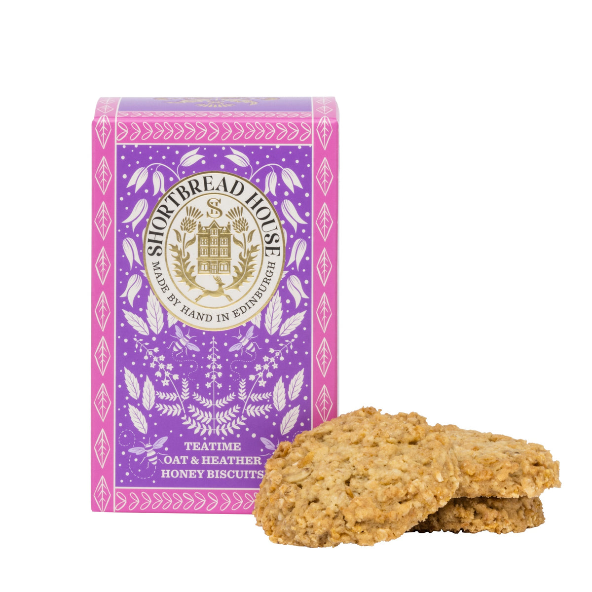 Purple and pink box of Shortbread House sweet oaties with 3 biscuits stacked in front.