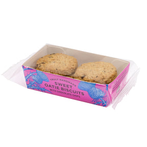 Sweet Oatie Biscuits with Chocolate Chips in a pink tray with thistle designs on a white background.