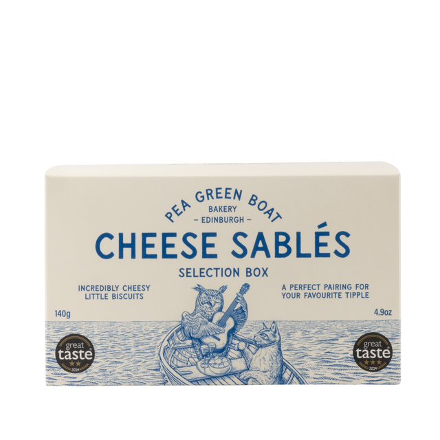 A selection box of cheese sablés with four varieties: Original, Cumin, Fennel & Chilli, and Nigella & Chive. The packaging is in a blue and white color scheme with an illustration of a boat, owl, and cat.