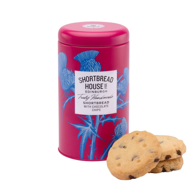 Pink tin of Shortbread House of Edinburgh shortbread with chocolate chips, accompanied by biscuits on a white background.