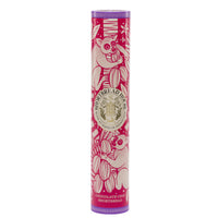 Cylindrical pink and purple shortbread tin with illustrations of lemurs and foliage on it.
