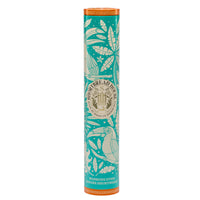 Teal and orange shortbread tin with leaf and toucan design on a white background