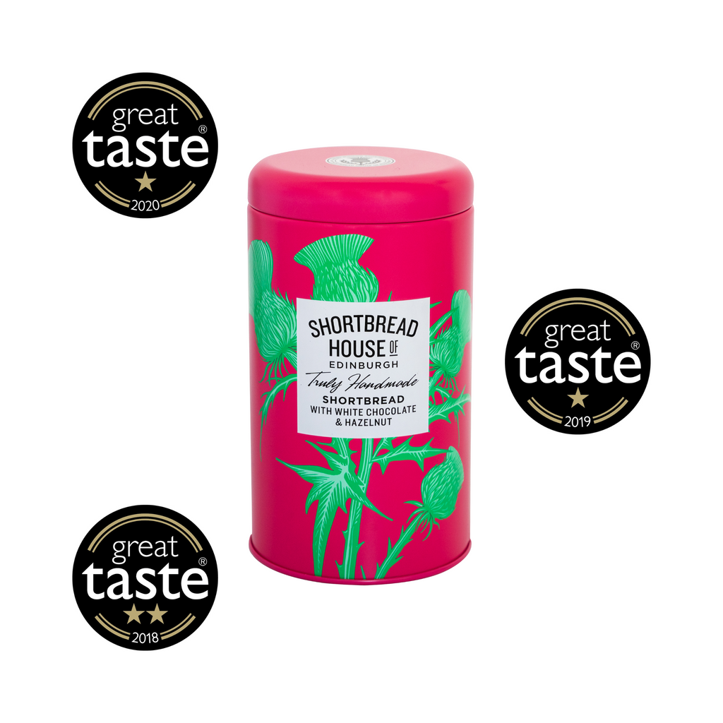 Pink tin with green thistle design and 'Great Taste' awards on a white background