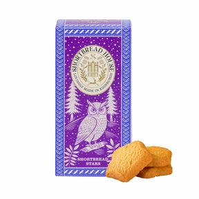 Purple box of Shortbread House shortbread stars with an owl illustration on a white background