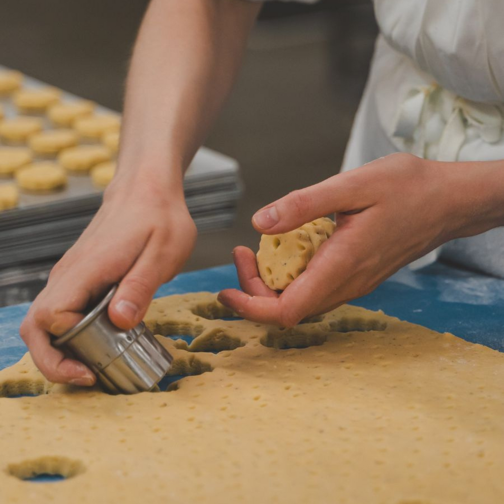 Biscuits being cut by hand