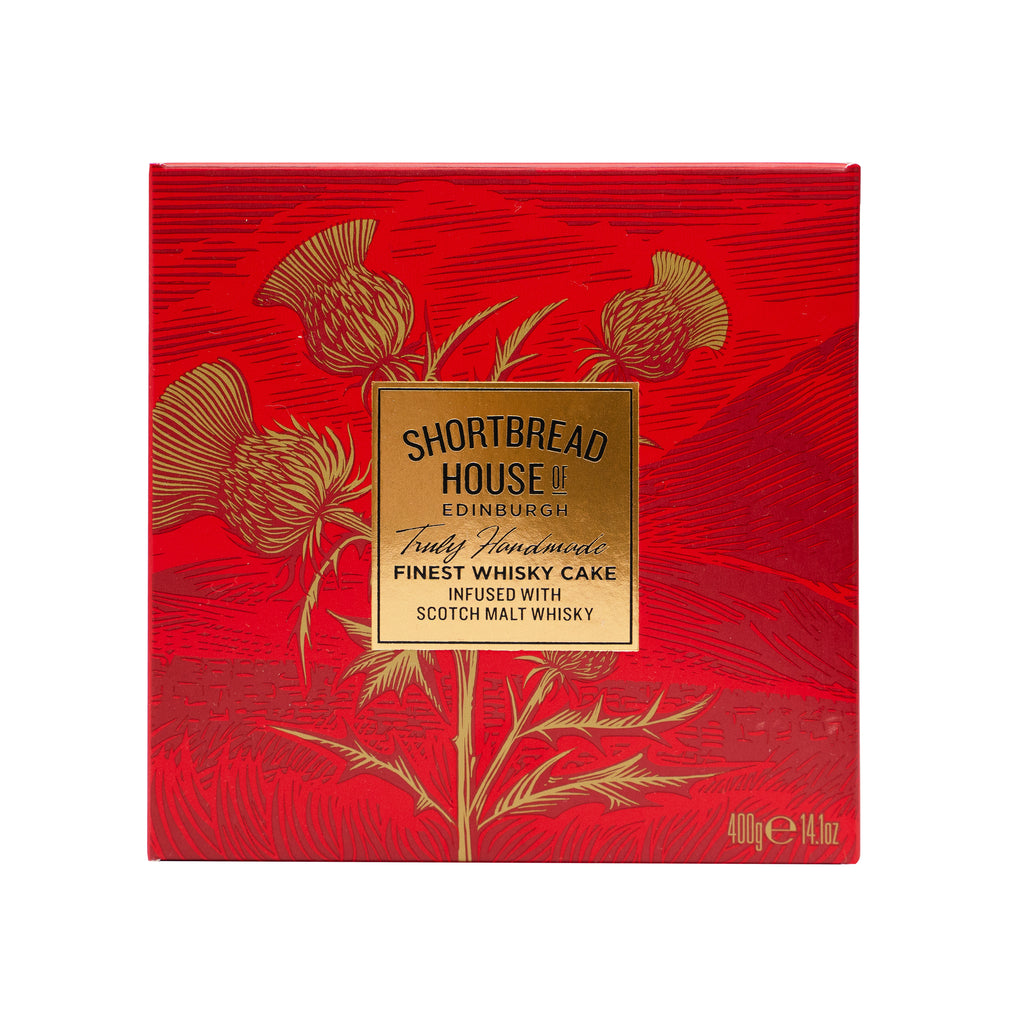 A red, square box with a striking design of gold thistles in the foreground, and subtle hills outlined in the background. In the centre of the box is a gold foiled square, with the Shortbread House of Edinburgh logo.